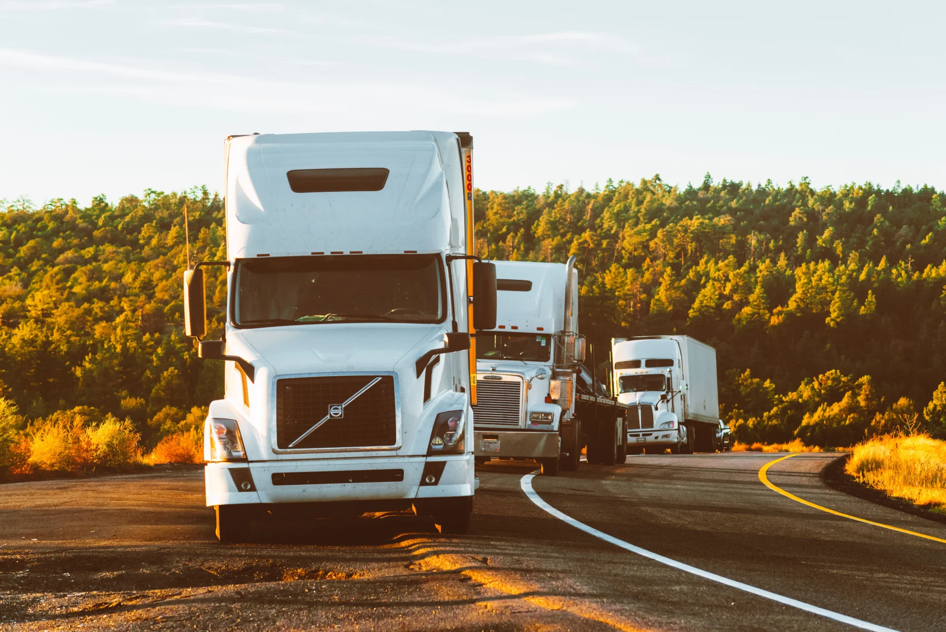 3 trucks on the road